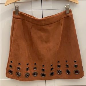 Tan brown suede mini skirt with metal grommets